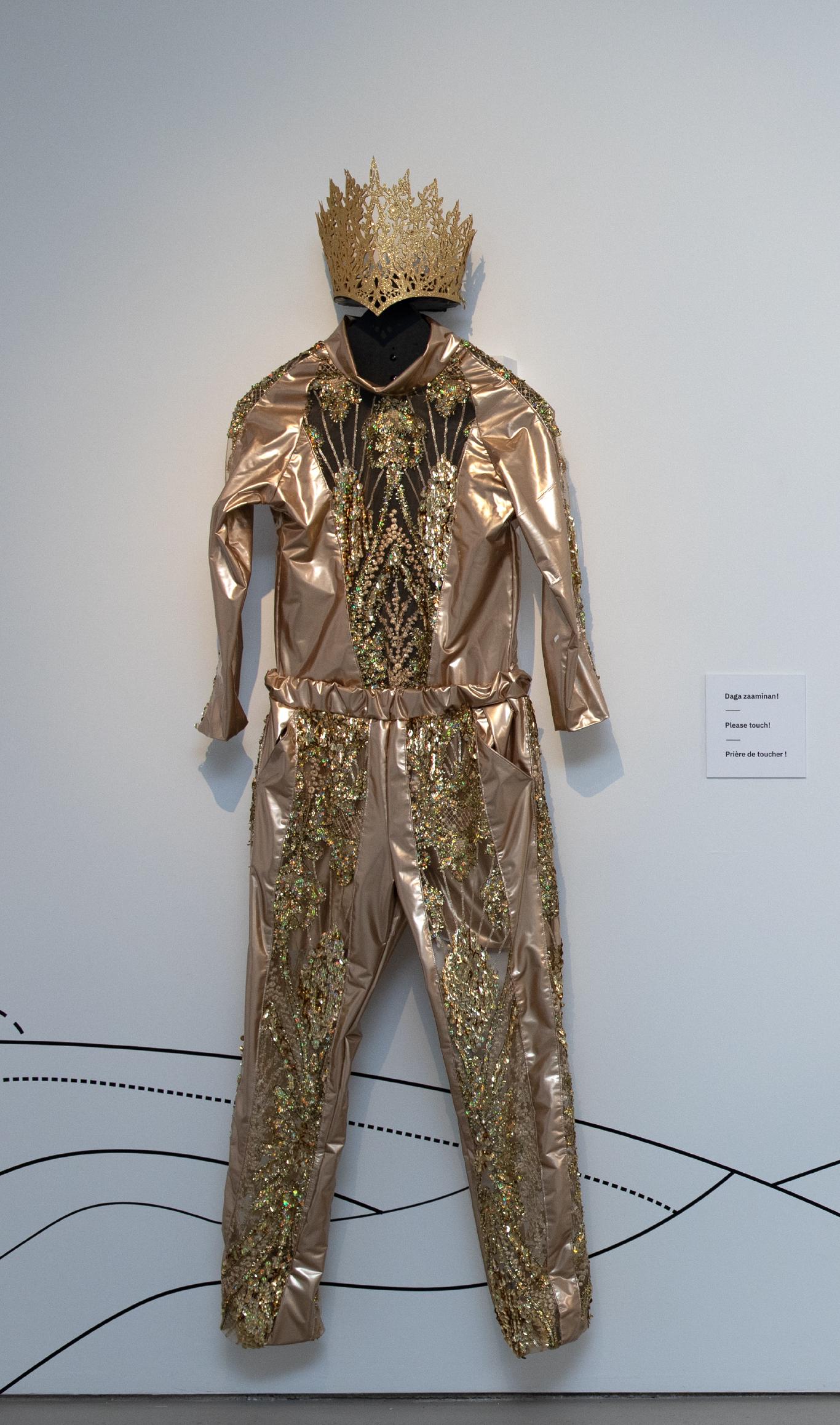 A detailed image of a sequined gold shirt.